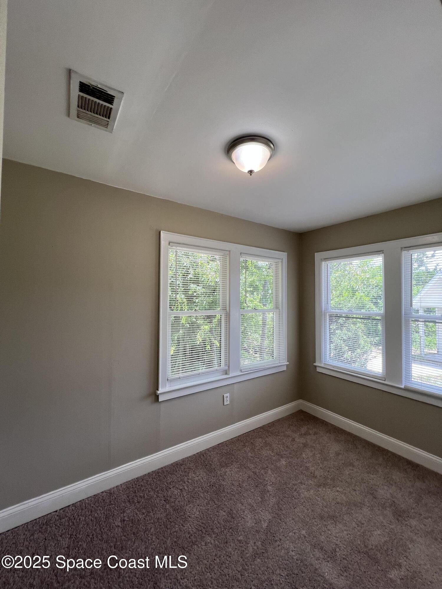 6500 June Drive Cocoa, FL 32926 - Photo 13 of 21 an empty room with a window