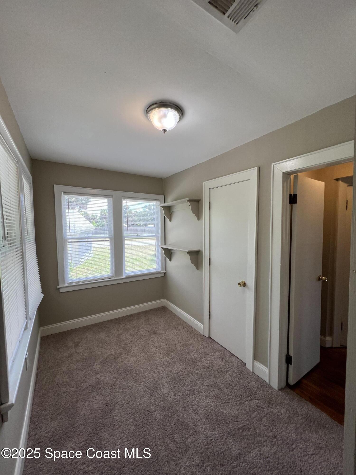 6500 June Drive Cocoa, FL 32926 - Photo 14 of 21 a view of an empty room with a window