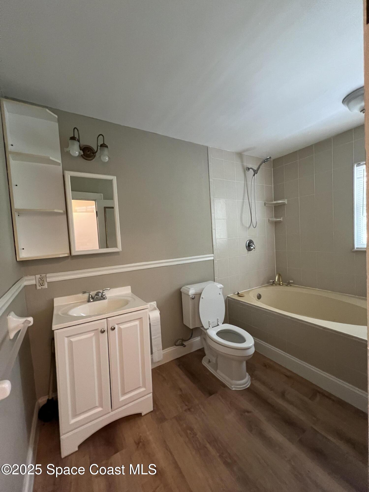 6500 June Drive Cocoa, FL 32926 - Photo 17 of 21 a bathroom with a sink a toilet and bathtub