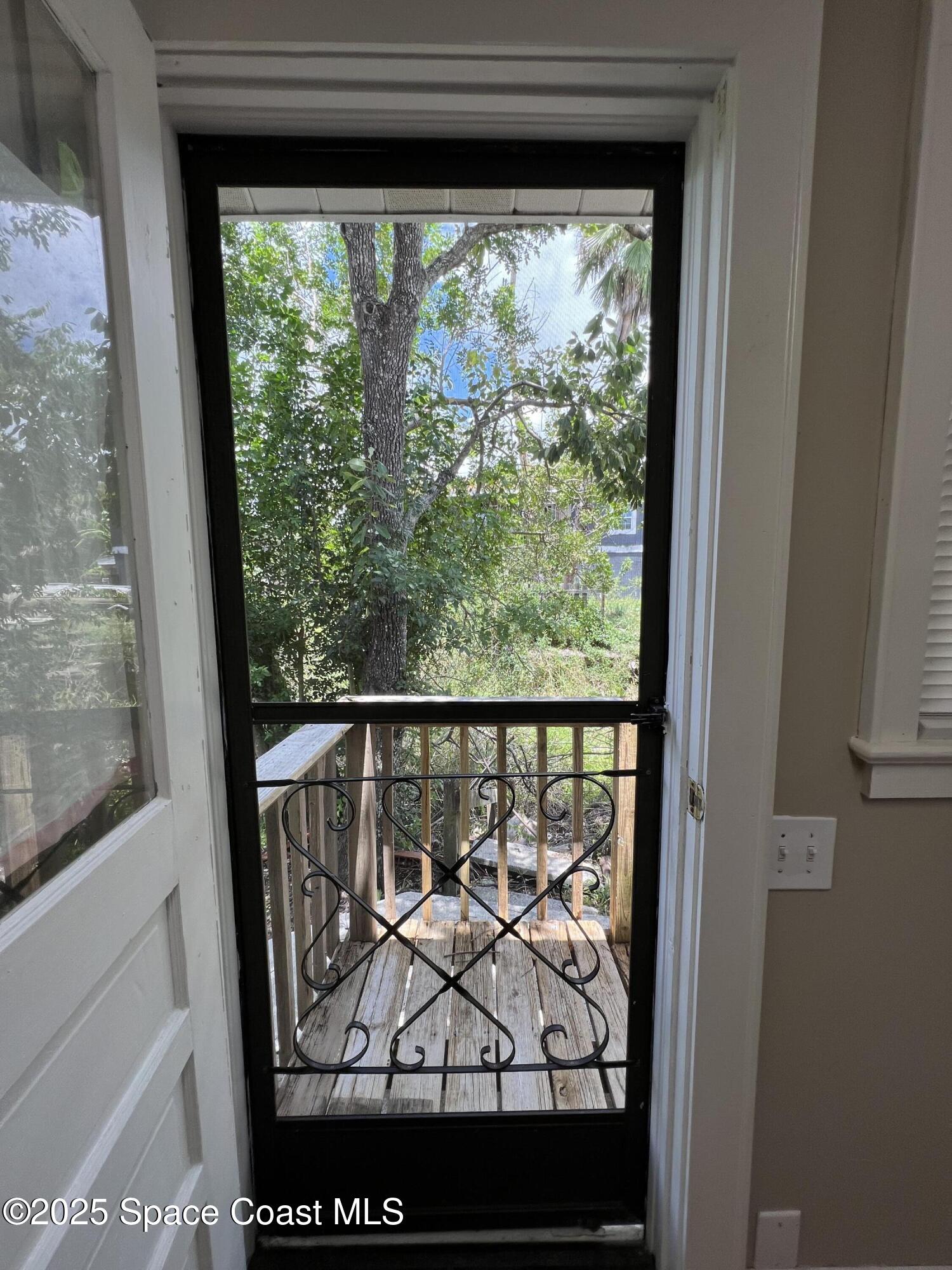 6500 June Drive Cocoa, FL 32926 - Photo 19 of 21 a view of a glass door and a window