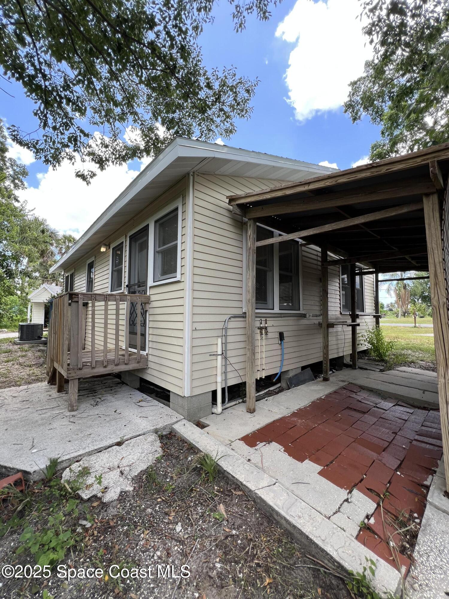 6500 June Drive Cocoa, FL 32926 - Photo 3 of 21 a view of a house with a yard