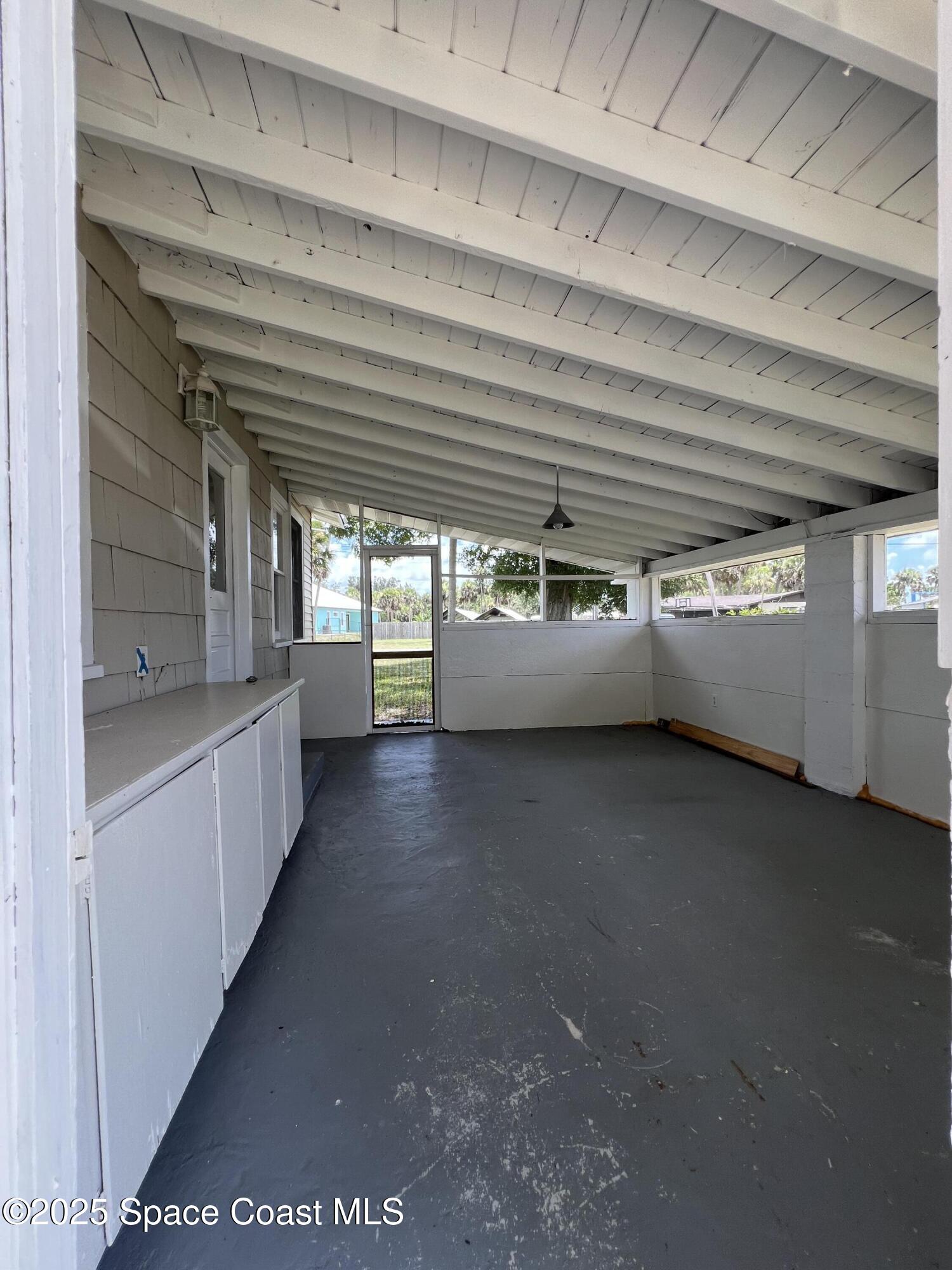 6500 June Drive Cocoa, FL 32926 - Photo 4 of 21 a view of empty room with windows