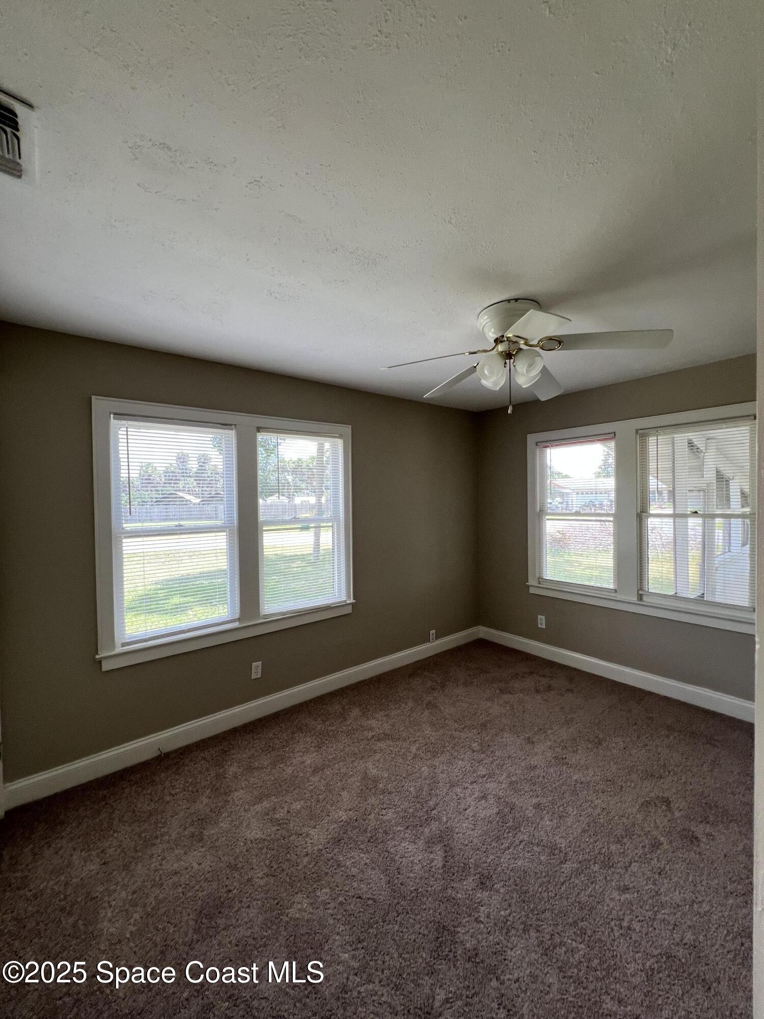 6500 June Drive Cocoa, FL 32926 - Photo 10 of 21 an empty room with a empty space and windows