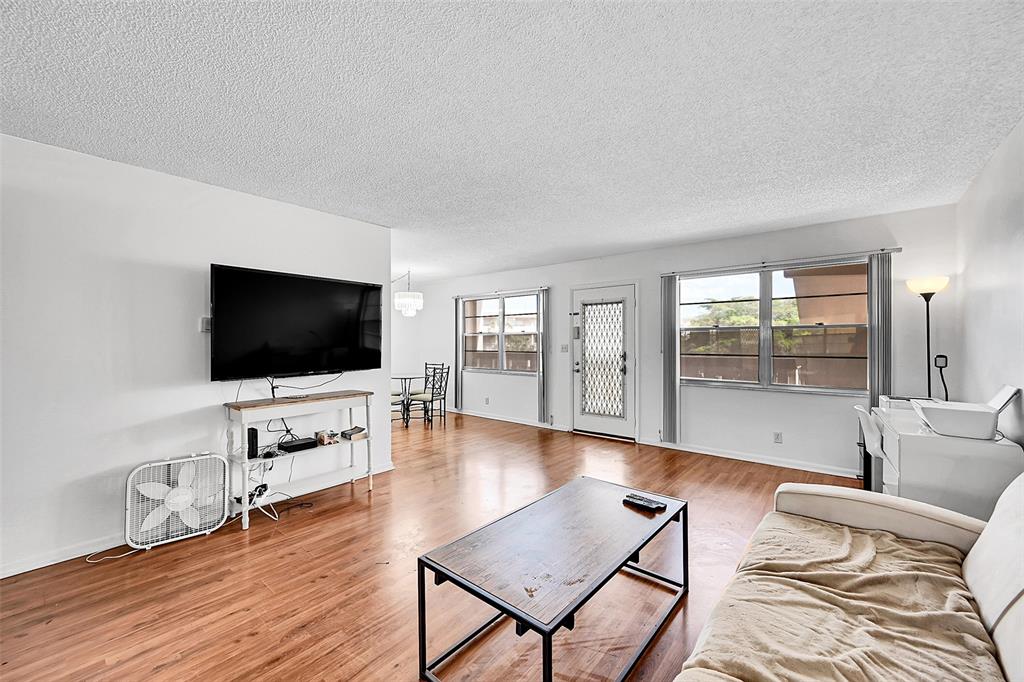 1901 Bermuda Circle, Unit L3 Coconut Creek, FL 33066 - Photo 13 of 27 a living room with furniture and a flat screen tv