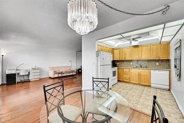a kitchen with stainless steel appliances granite countertop a stove and refrigerator