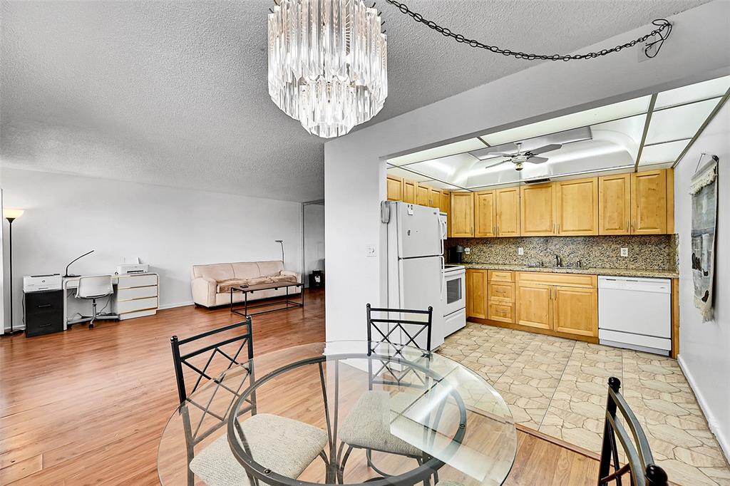 1901 Bermuda Circle, Unit L3 Coconut Creek, FL 33066 - Photo 14 of 27 a kitchen with stainless steel appliances granite countertop a stove and refrigerator