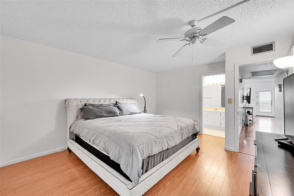 1901 Bermuda Circle, Unit L3 Coconut Creek, FL 33066 - Photo 17 of 27 a bedroom with a bed and closet