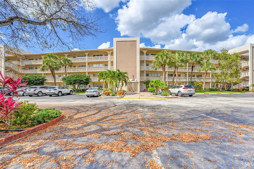 1901 Bermuda Circle, Unit L3 Coconut Creek, FL 33066 - Photo 26 of 27 a view of a building with sitting area