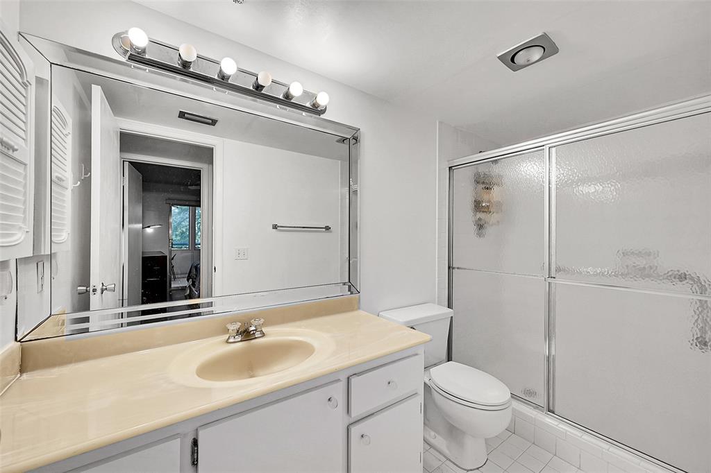 1901 Bermuda Circle, Unit L3 Coconut Creek, FL 33066 - Photo 5 of 27 a bathroom with a sink toilet and shower