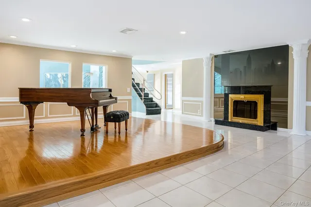 a large kitchen with stainless steel appliances a stove a sink a microwave and cabinets