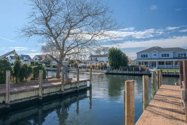 a view of a lake with a bench next to a lake