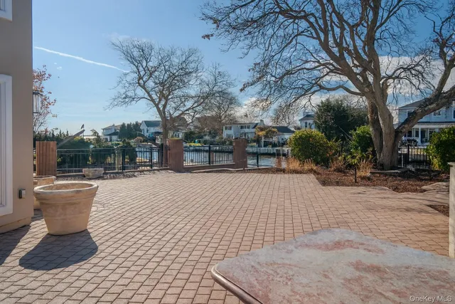 a view of a patio with a table and chairs