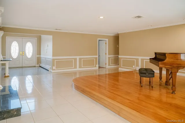 a lobby with furniture and a fireplace