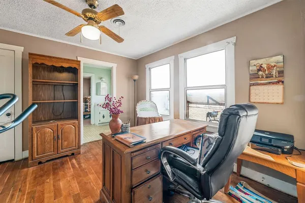 a living room with furniture a chandelier and a window