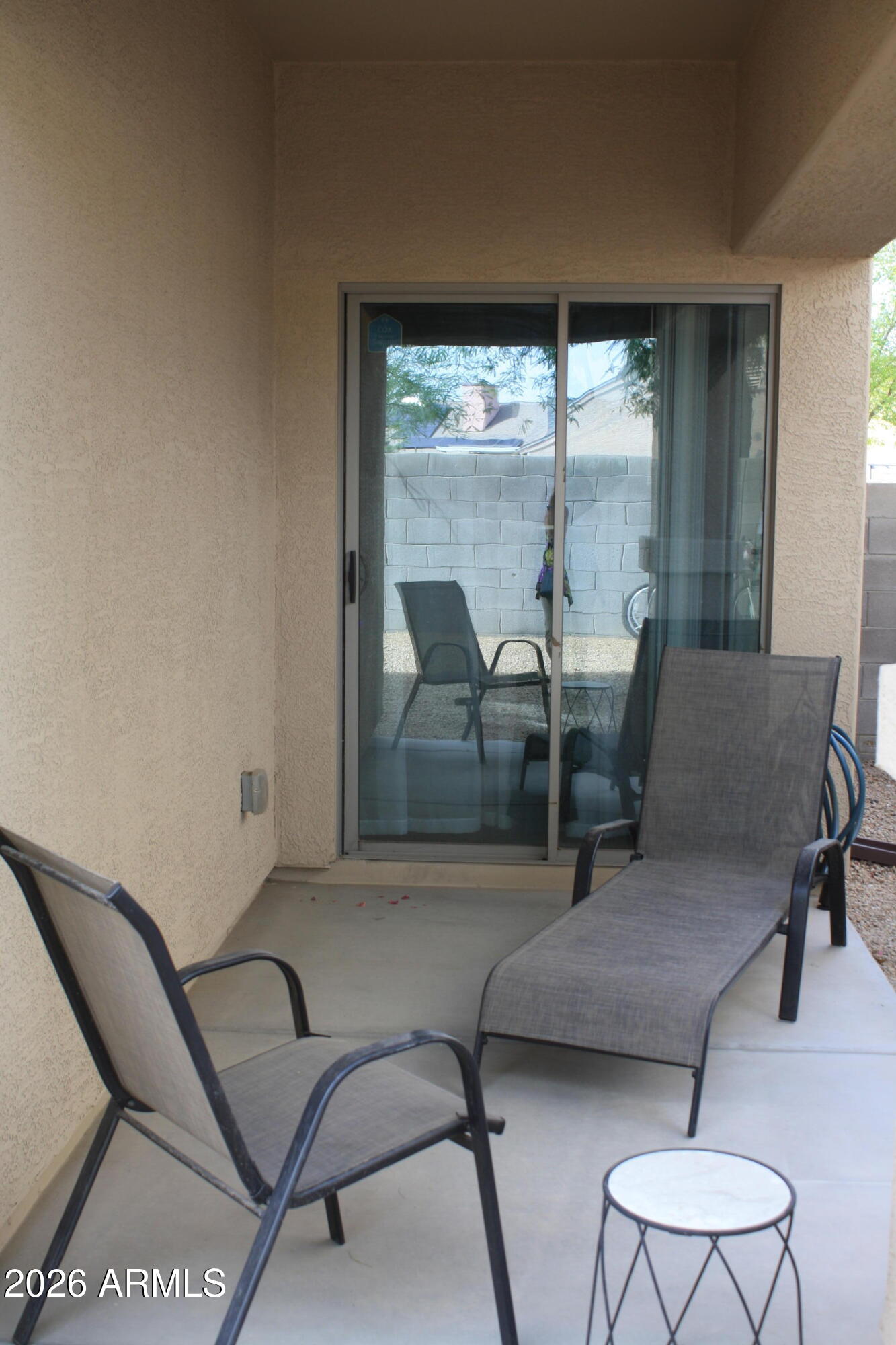10225 West Camelback Road, Unit 19 Phoenix, AZ 85037 - Photo 39 of 51 a dining room with furniture and a floor to ceiling window