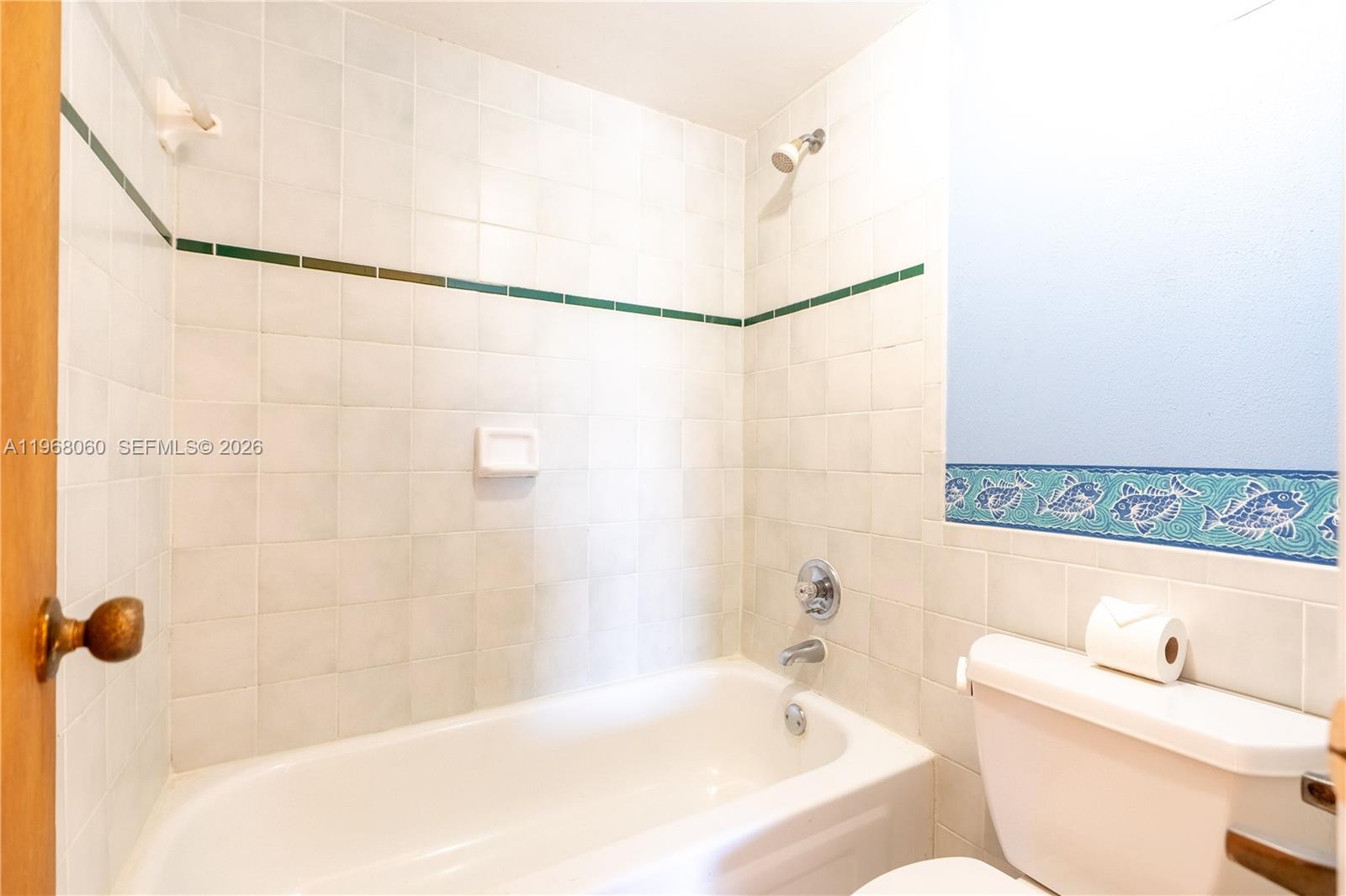 430 Commodore Drive, Unit 314 Plantation, FL 33325 - Photo 13 of 54 a bathroom with a bathtub and a shower