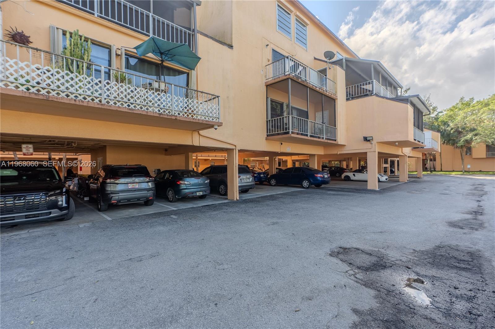 430 Commodore Drive, Unit 314 Plantation, FL 33325 - Photo 17 of 54 a view of a street with cars