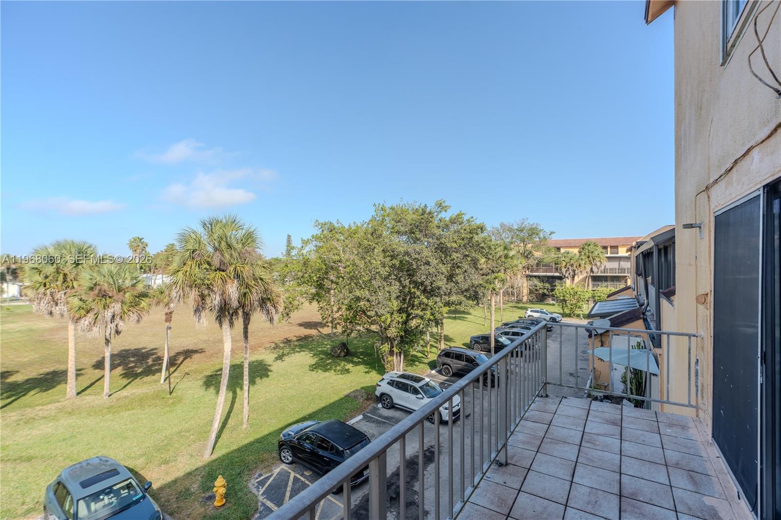 430 Commodore Drive, Unit 314 Plantation, FL 33325 - Photo 19 of 54 a view of a balcony with an outdoor space