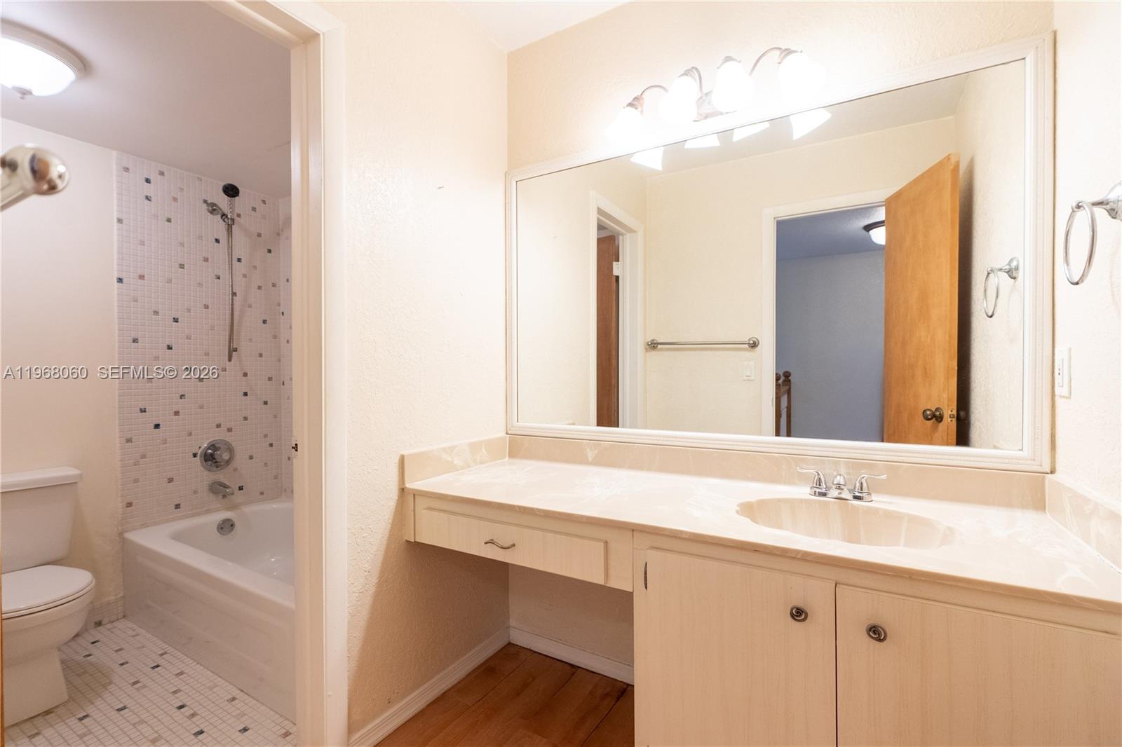 430 Commodore Drive, Unit 314 Plantation, FL 33325 - Photo 26 of 54 a bathroom with a granite countertop sink a toilet and shower