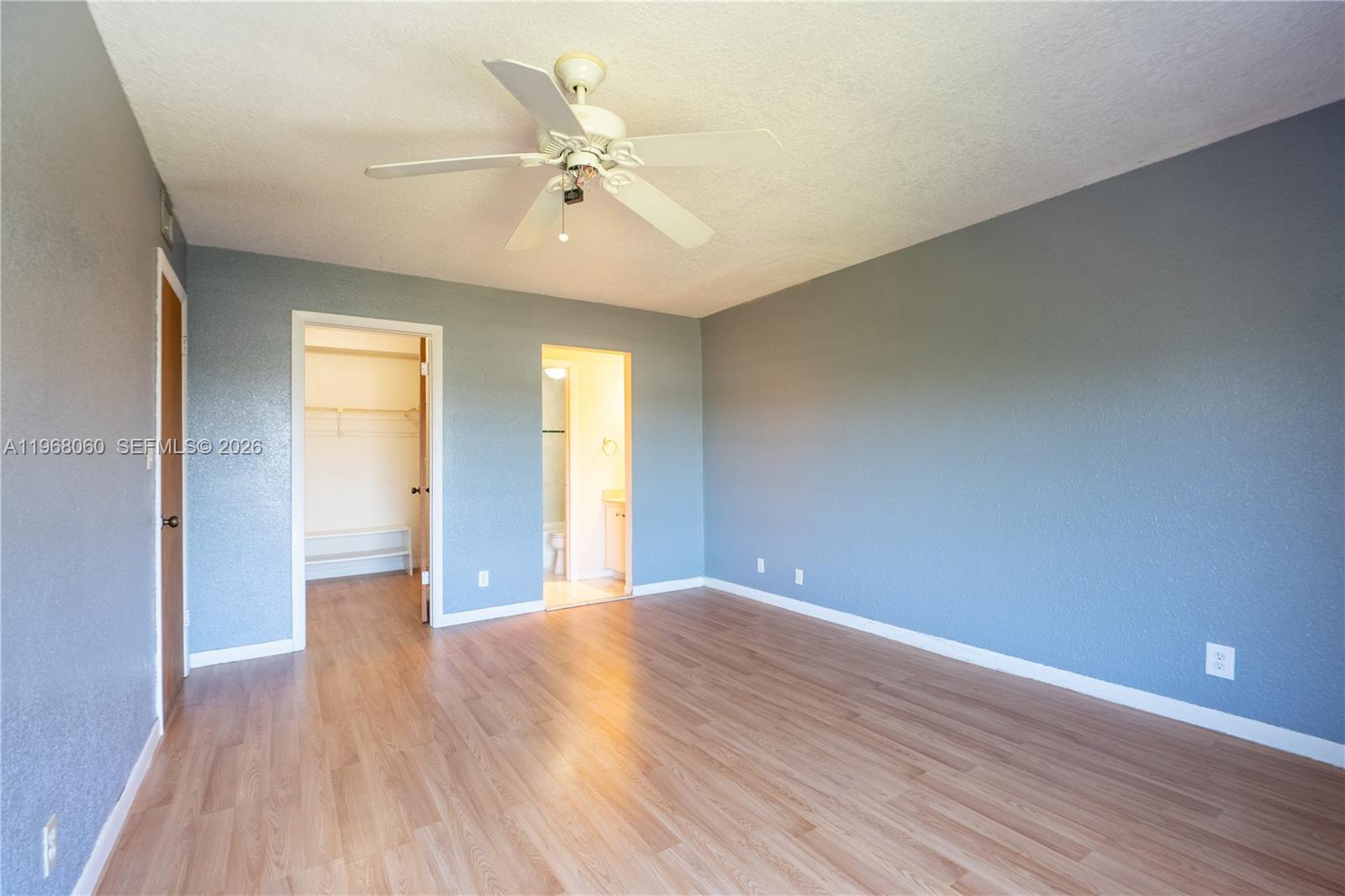 430 Commodore Drive, Unit 314 Plantation, FL 33325 - Photo 28 of 54 a view of an empty room with wooden floor and a window