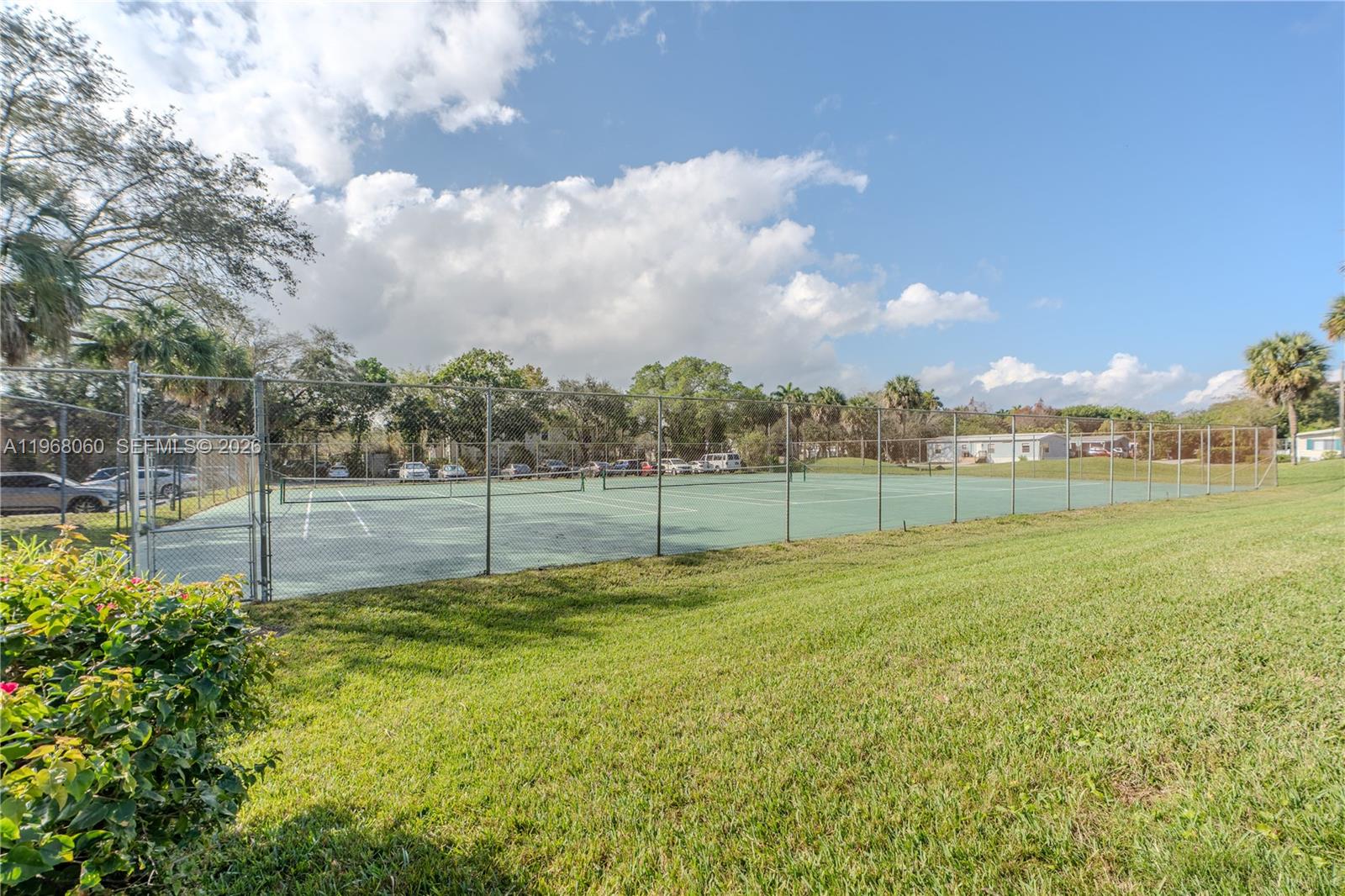 430 Commodore Drive, Unit 314 Plantation, FL 33325 - Photo 31 of 54 a view of a pathway with a garden