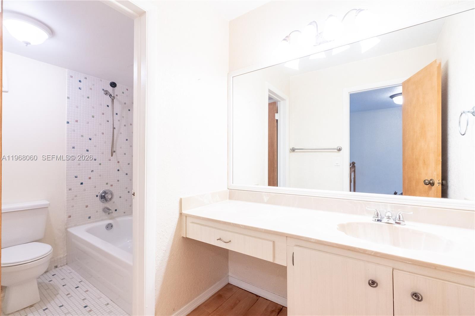 430 Commodore Drive, Unit 314 Plantation, FL 33325 - Photo 37 of 54 a bathroom with a sink a toilet and a bathtub