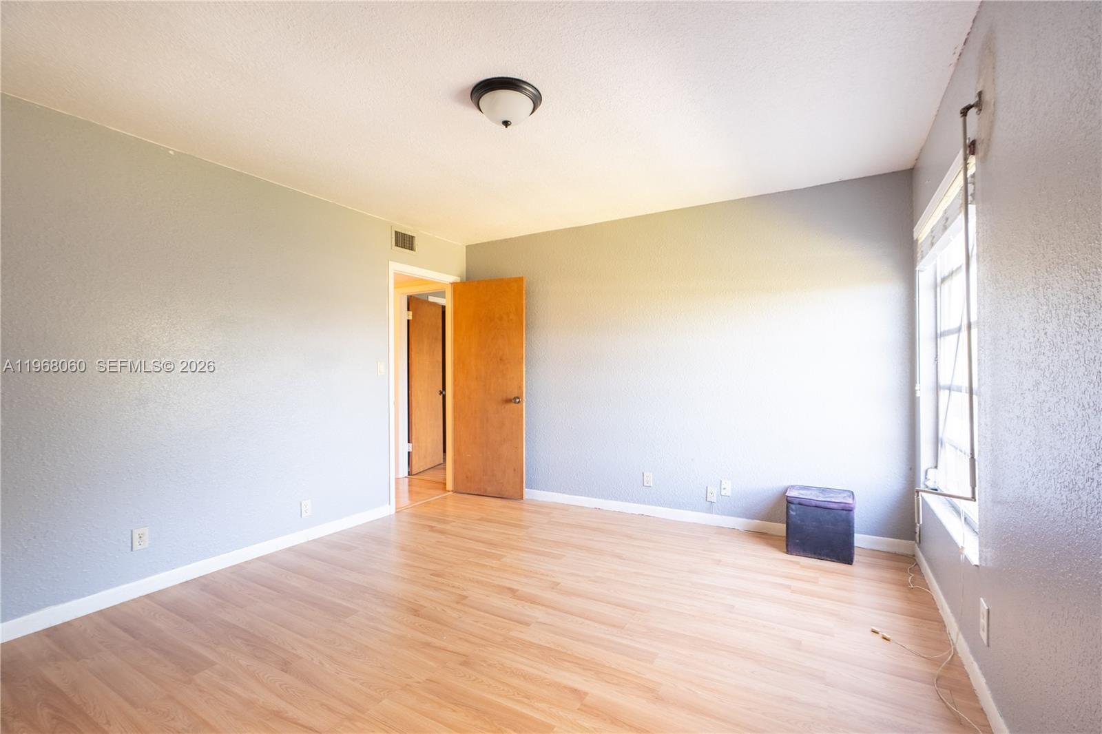 430 Commodore Drive, Unit 314 Plantation, FL 33325 - Photo 9 of 54 a view of empty room with wooden floor and fan