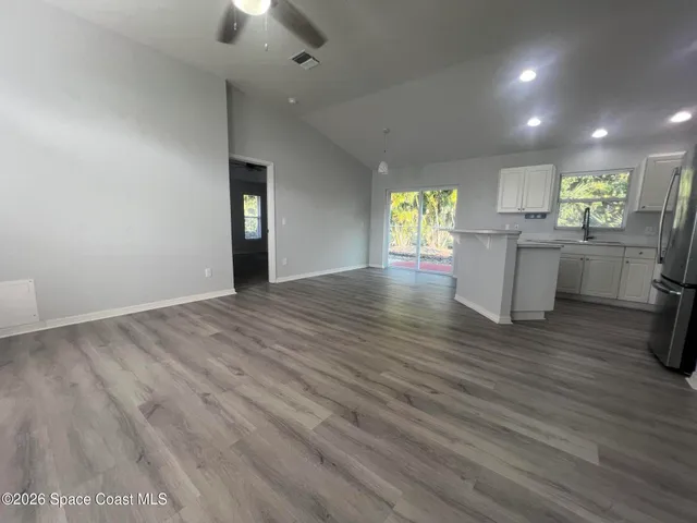 a view of an empty room and window