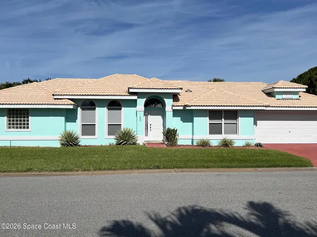 a kitchen with appliances a sink and a counter top space