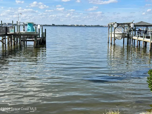 a bathroom with a double vanity sink a mirror and a shower