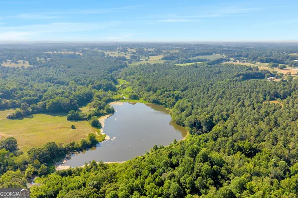 an aerial view of a houses with a yard