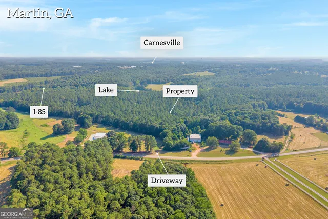 a view of a swimming pool with a yard