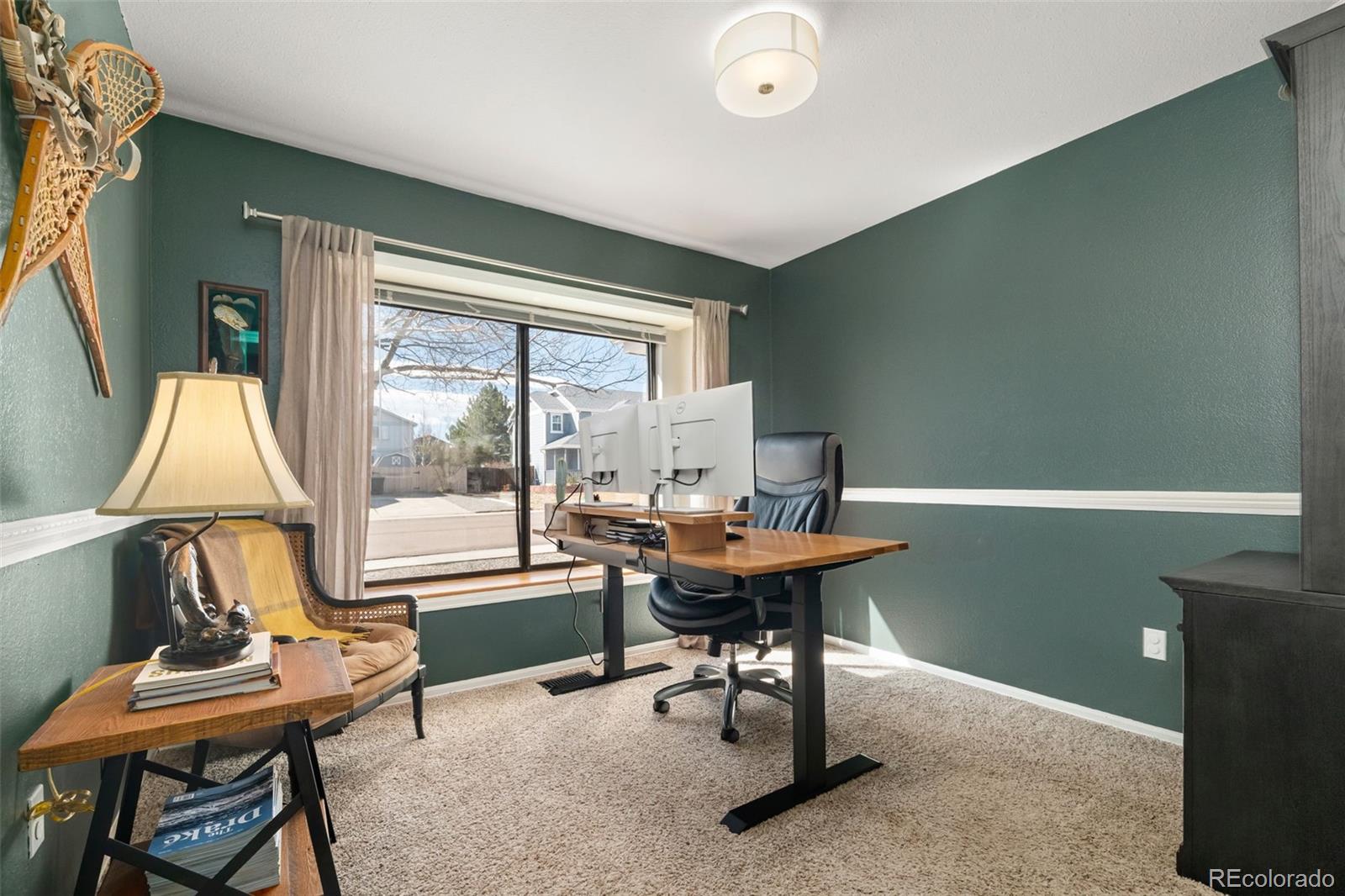 6404 Raleigh Street Arvada, CO 80003 - Photo 28 of 50 a workspace with furniture and a window