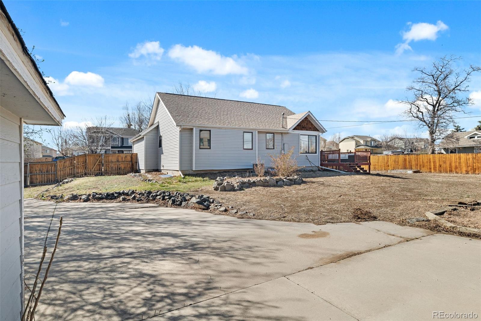 6404 Raleigh Street Arvada, CO 80003 - Photo 32 of 50 a view of a dirt road and a building