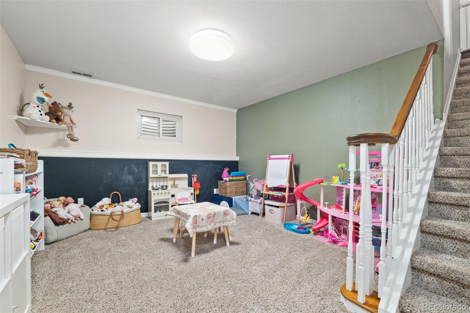 6404 Raleigh Street Arvada, CO 80003 - Photo 35 of 50 a living room with furniture and a couch
