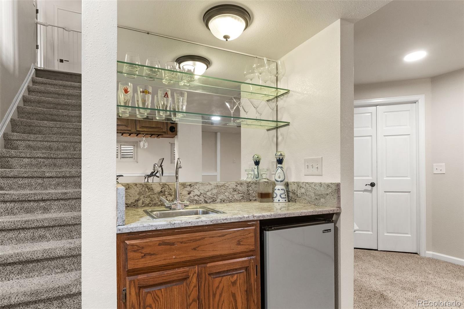 6404 Raleigh Street Arvada, CO 80003 - Photo 37 of 50 a bathroom with a sink and a mirror