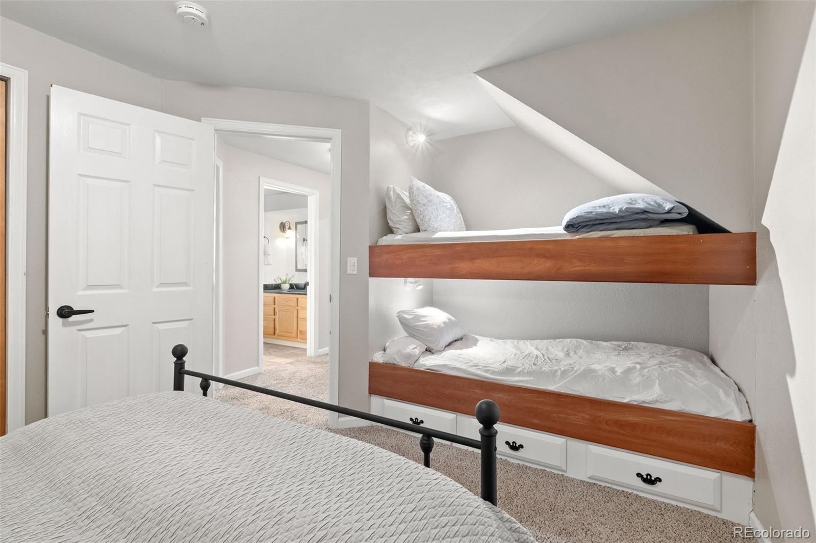 6404 Raleigh Street Arvada, CO 80003 - Photo 43 of 50 a bedroom with a bed and window