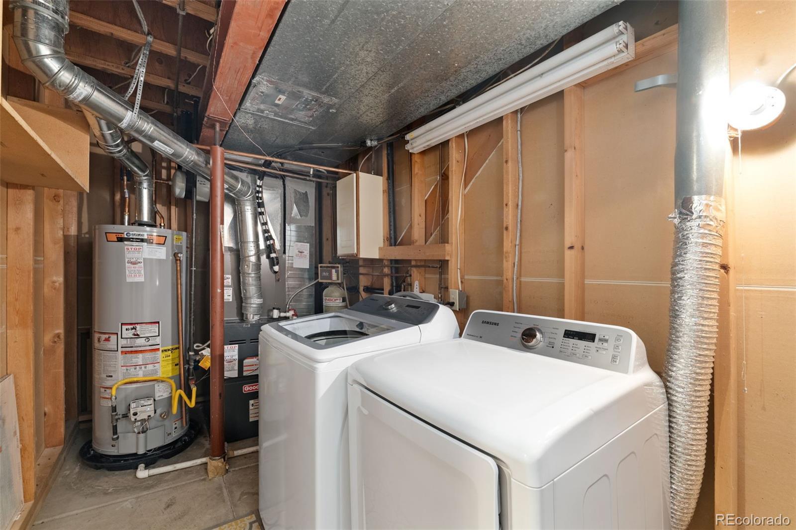 6404 Raleigh Street Arvada, CO 80003 - Photo 46 of 50 a utility room with dryer and washer