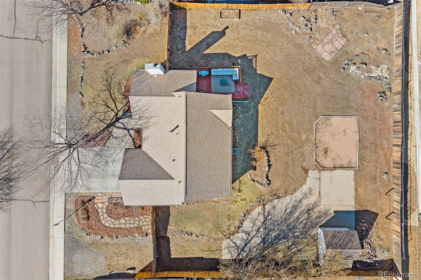 6404 Raleigh Street Arvada, CO 80003 - Photo 47 of 50 an aerial view of a house with a yard