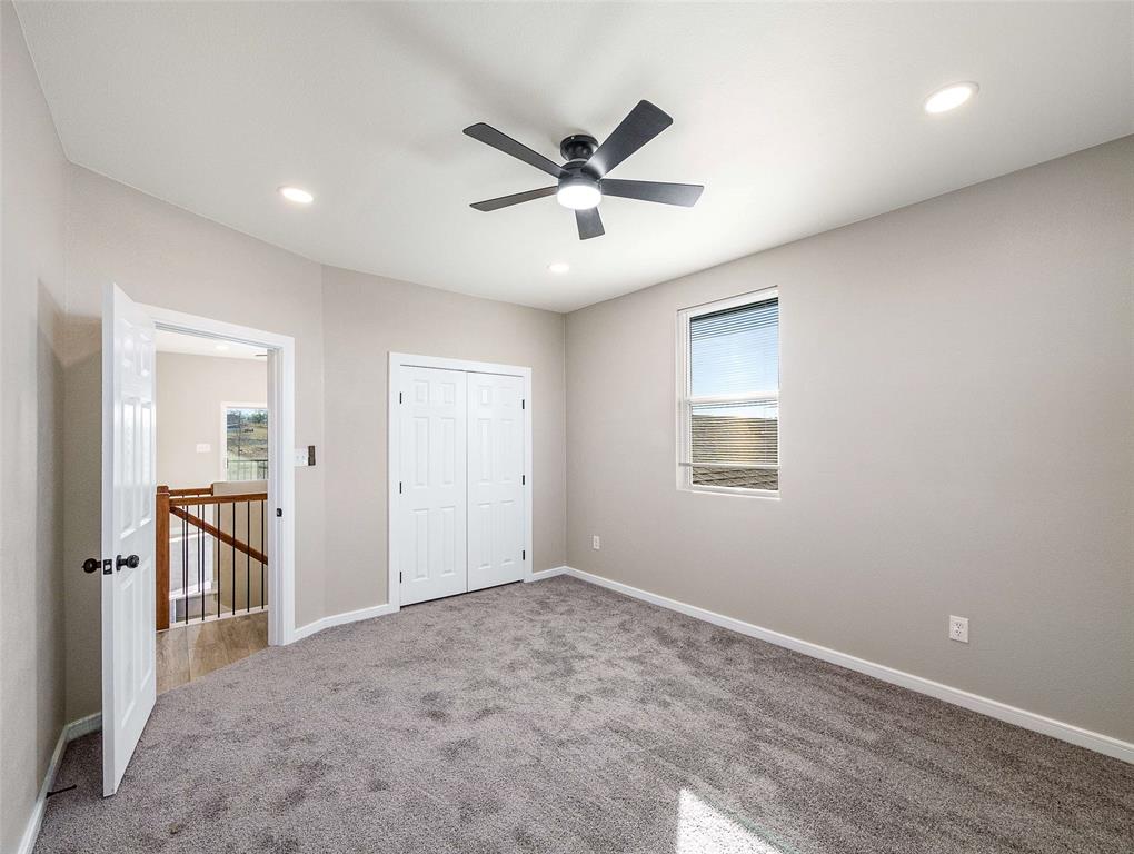 1061 Zmolek Road Ennis, TX 75119 - Photo 20 of 40 a view of a livingroom with a ceiling fan and wooden floor