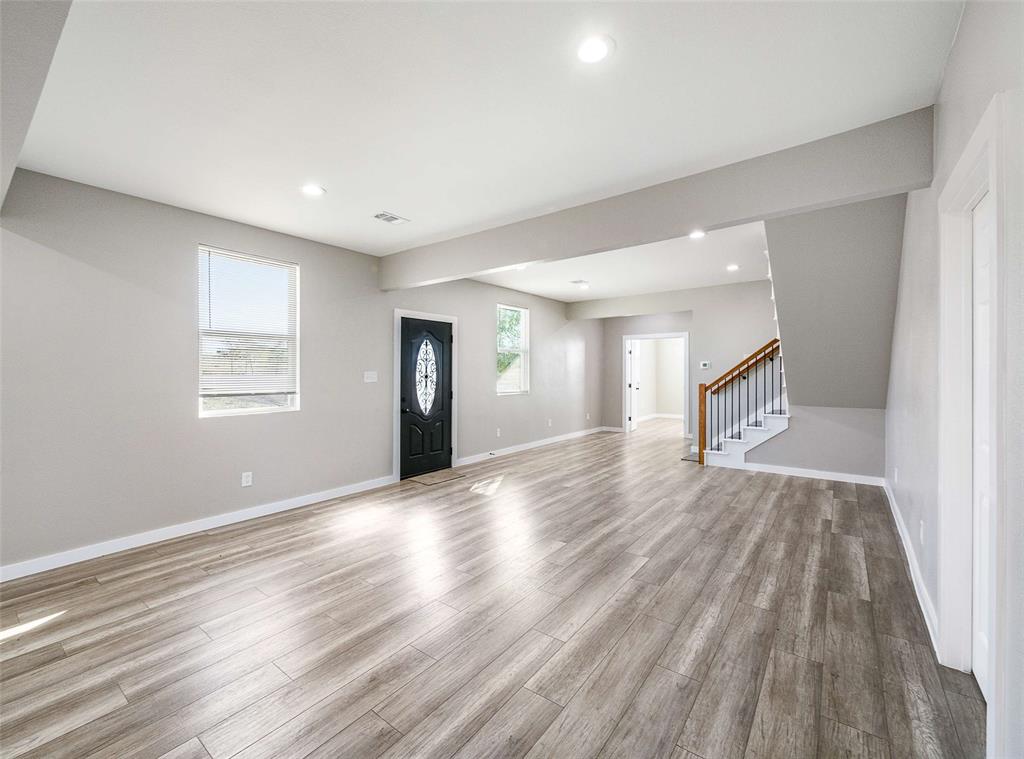 1061 Zmolek Road Ennis, TX 75119 - Photo 21 of 40 a view of an empty room and wooden floor