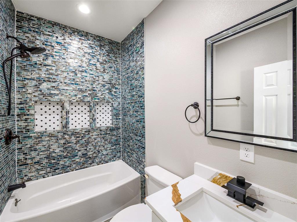 1061 Zmolek Road Ennis, TX 75119 - Photo 24 of 40 a bathroom with a bathtub and shower