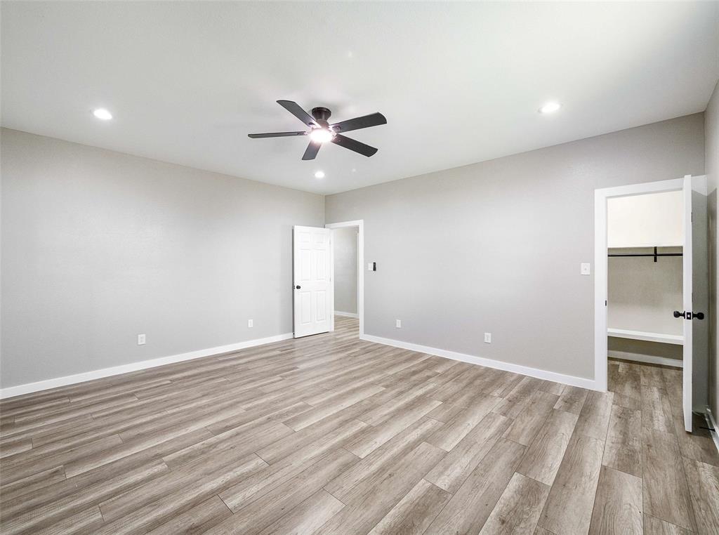 1061 Zmolek Road Ennis, TX 75119 - Photo 27 of 40 wooden floor in an empty room with a window