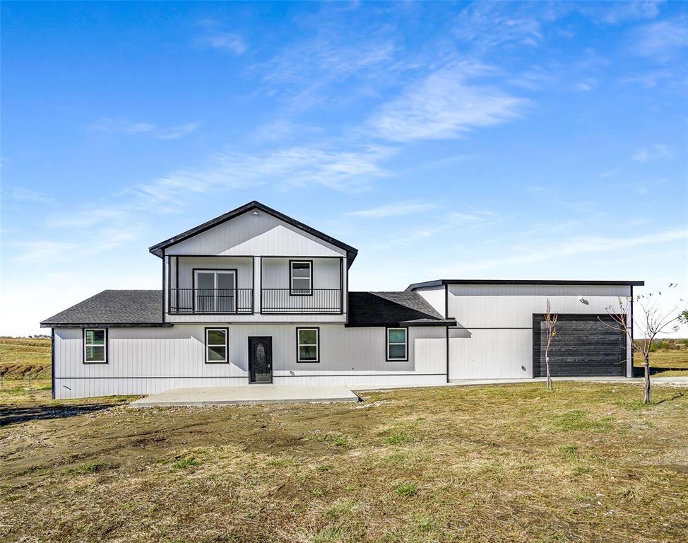 1061 Zmolek Road Ennis, TX 75119 - Photo 3 of 40 a front view of a house with a yard