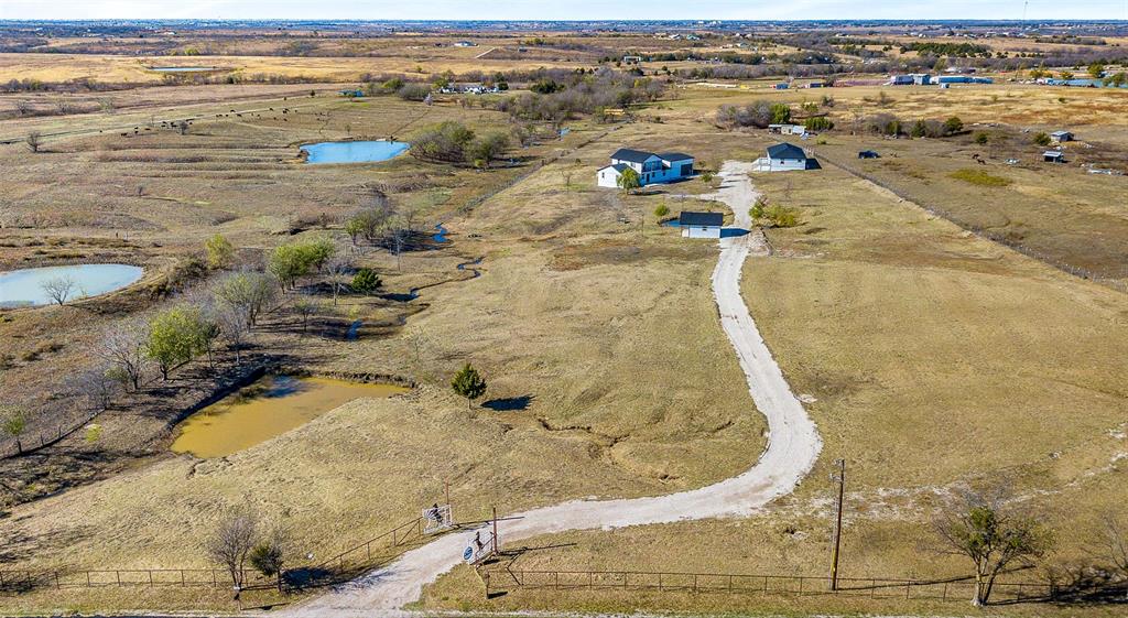1061 Zmolek Road Ennis, TX 75119 - Photo 34 of 40 an aerial view of residential houses with outdoor space