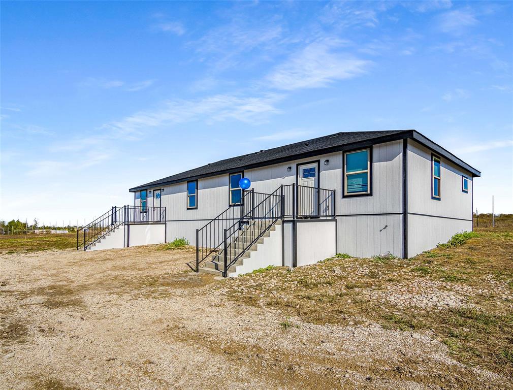 1061 Zmolek Road Ennis, TX 75119 - Photo 5 of 40 a house view with a outdoor space