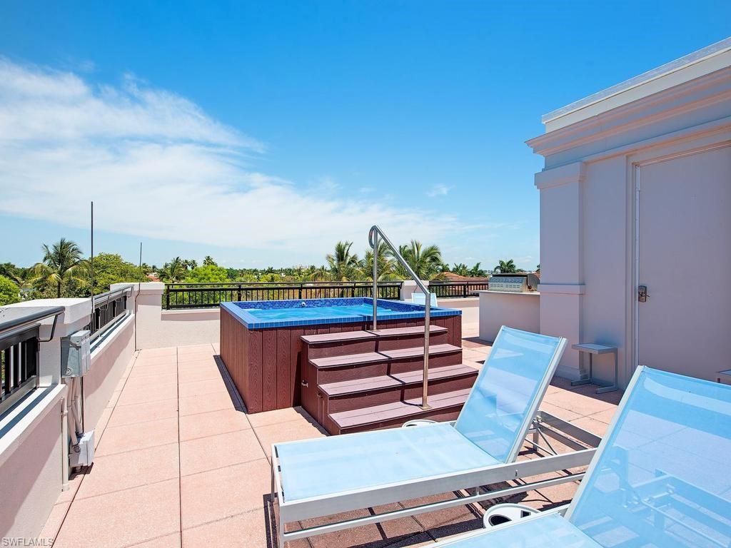 490 5th Street South, Unit 101 Naples, FL 34102 - Photo 29 of 34 a view of a terrace with furniture