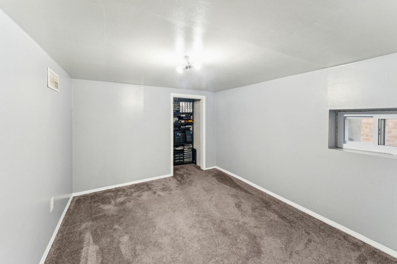 2547 Davisson Street River Grove, IL 60171 - Photo 17 of 31 an empty room with closet and windows
