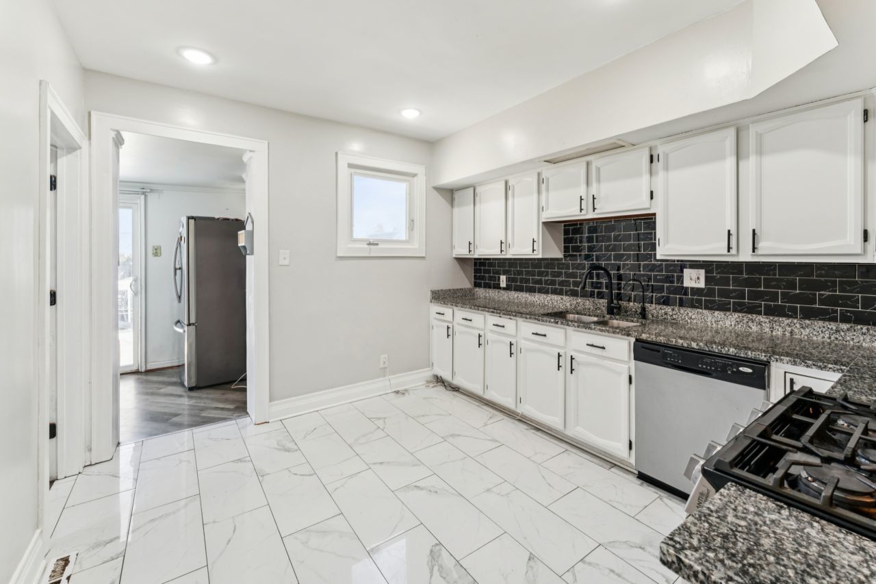 2547 Davisson Street River Grove, IL 60171 - Photo 5 of 31 a kitchen with stainless steel appliances granite countertop a stove a sink and a refrigerator