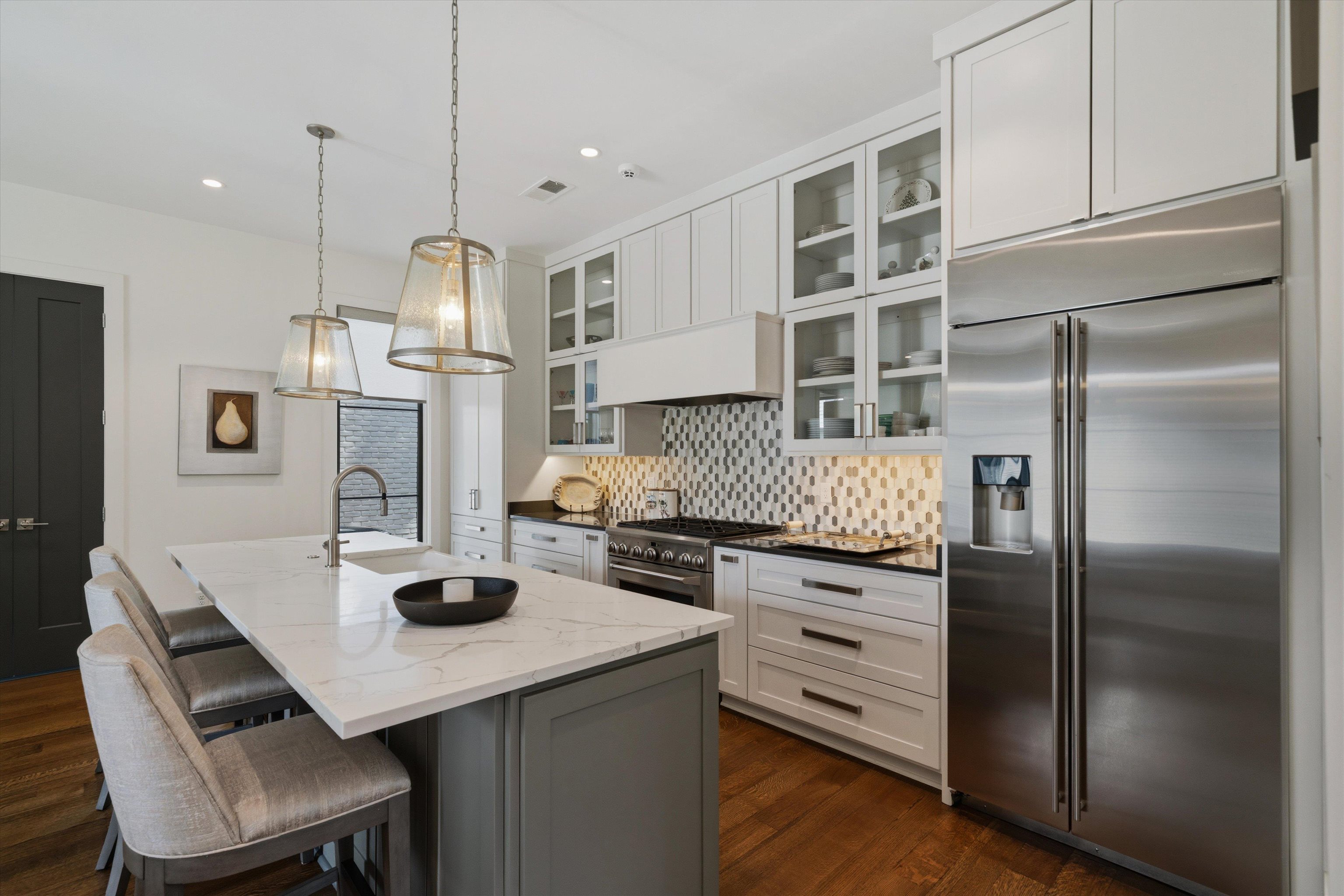 4710 Gwynne Road Memphis, TN 38117 - Photo 32 of 40 a kitchen with kitchen island a counter and a refrigerator